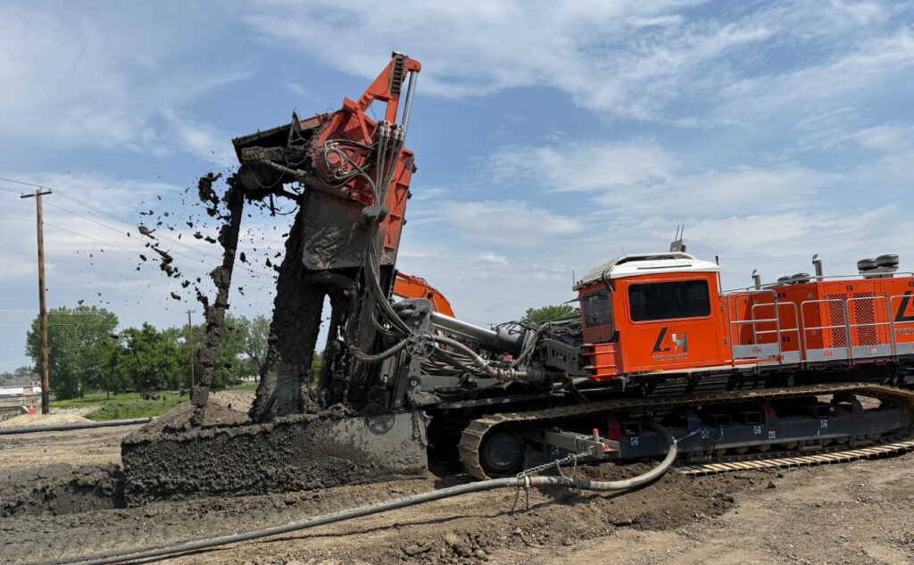 L4H One-Pass Trencher performing environmental remediation and erosion control services photo